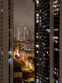 Illuminated buildings in city at night