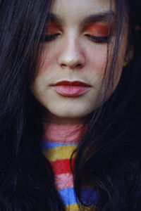 Close-up portrait of beautiful teenage girl with make-up