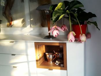 Flower vase on table at home