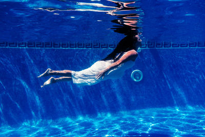 Man swimming in pool