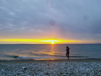 Scenic view of sea at sunset