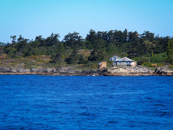 Scenic view of calm sea against blue sky