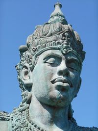 Low angle view of vishnu statue at garuda wisnu kencana against sky