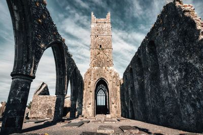 Dramatic scene of historical landmark claregalway friary in county galway, ireland