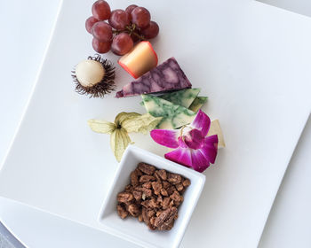 High angle view of flowers in plate on table