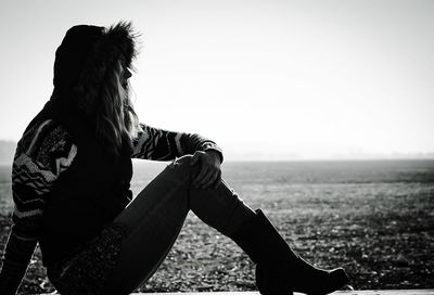 Woman standing against sky