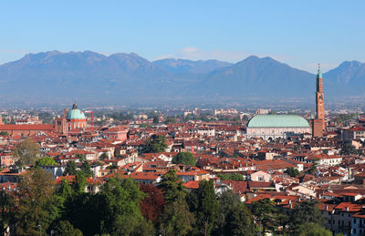 High angle view of townscape and mountains against sky