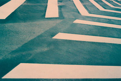 High angle view of arrow symbol on road