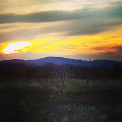 Scenic view of dramatic sky during sunset