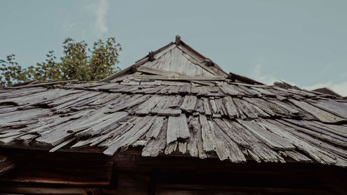 Low angle view of roof against sky