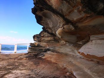 Close-up of sea shore against sky