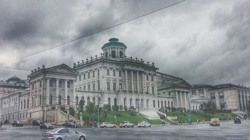 View of buildings against cloudy sky