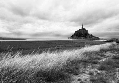 Mont saint michel between cloud and field 