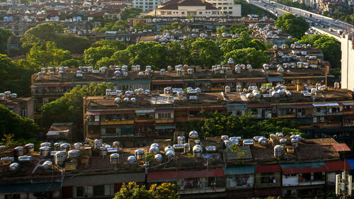 High angle view of trees and buildings in town