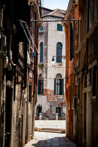 Narrow alley amidst buildings in city