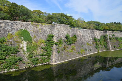 View of castle on mountain against sky