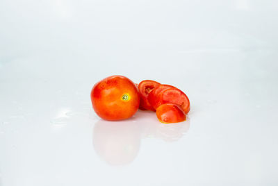 Close-up of oranges against white background