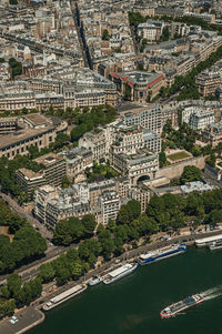 Buildings skyline and river seine seen from the eiffel tower in paris. the famous capital of france.