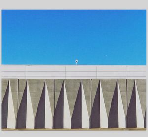 Clothes hanging against clear sky