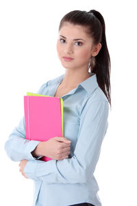Portrait of a smiling young woman against white background