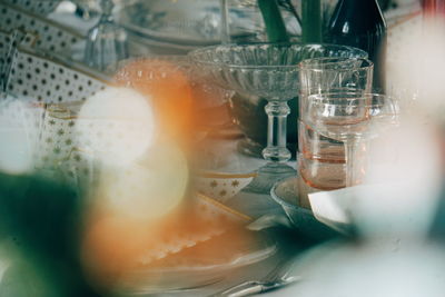 Close-up of drinking glasses and napkins on table