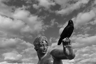 Low angle view of statue against sky