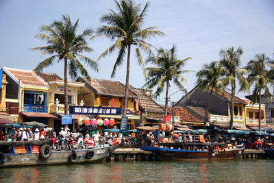 Boats in river against built structures