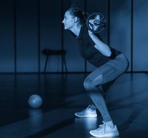 Low section of woman standing in gym
