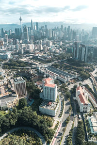 High angle view of buildings in city against sky