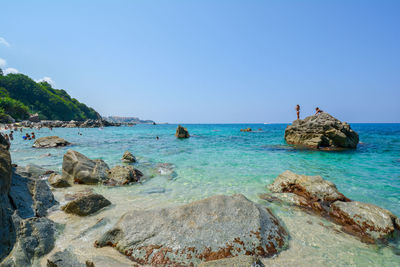 Scenic view of sea against clear blue sky