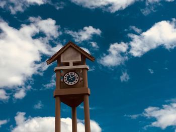 Low angle view of clock tower against sky