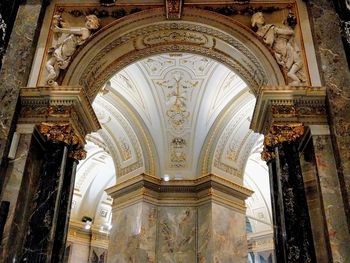 Low angle view of ornate ceiling in historic building