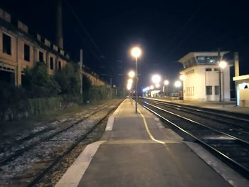 View of railroad tracks at night