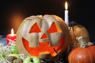 Close-up of illuminated pumpkin against black background