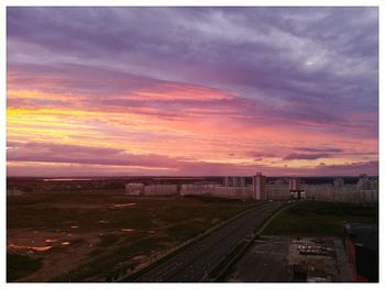 Railroad tracks against sky during sunset