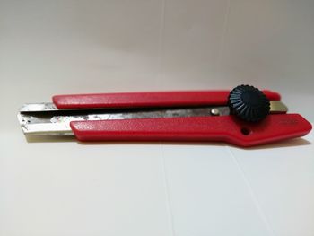 High angle view of red toy on table against white background