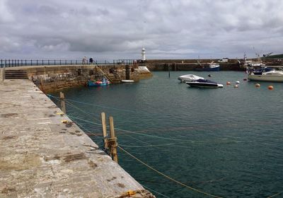 Boats moored at harbor