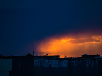 Low angle view of silhouette buildings against sky during sunset