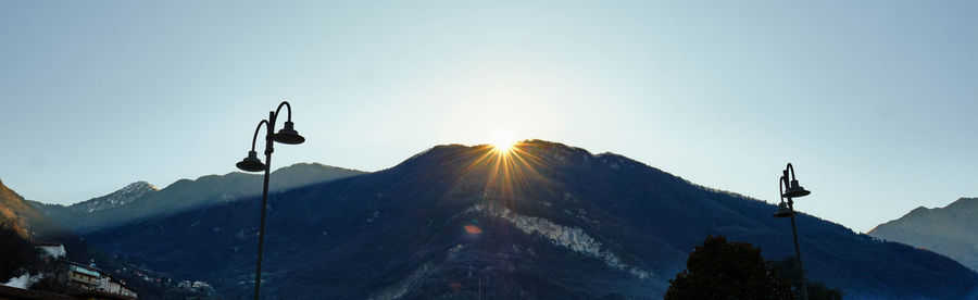 Panoramic view of mountains against clear sky