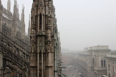 Cathedral against sky in foggy weather