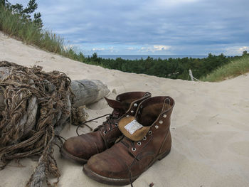 High angle view of shoes on beach