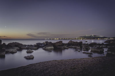 Scenic view of sea against sky at night