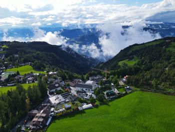 High angle view of buildings and mountains against sky