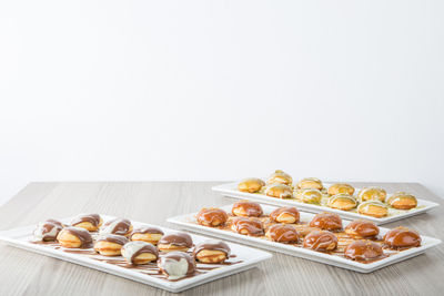 Close-up of food on table against white background