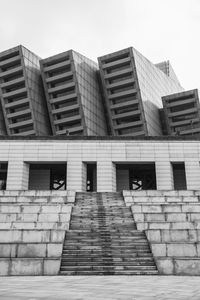 Low angle view of staircase in city against clear sky