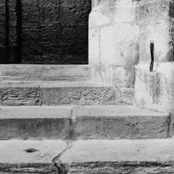 Woman standing against wall