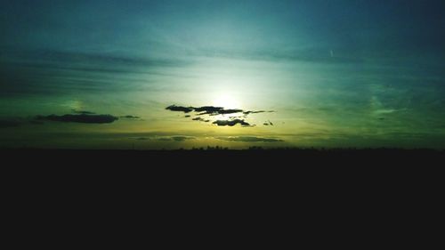 Scenic view of landscape against sky at sunset