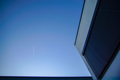 Low angle view of building against blue sky