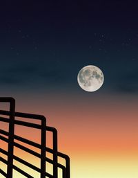 Low angle view of moon against sky at night