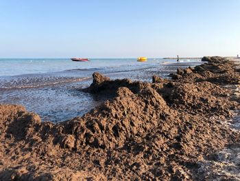 Scenic view of sea against clear sky